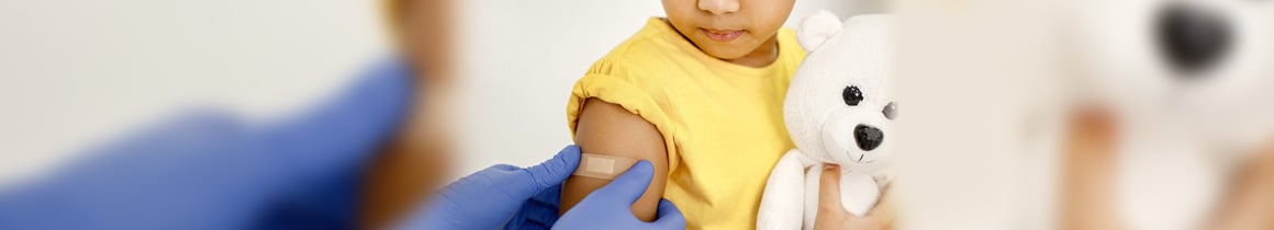 Toddler being vaccinated