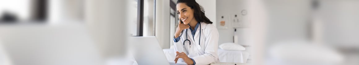 Woman checking health resources on a laptop