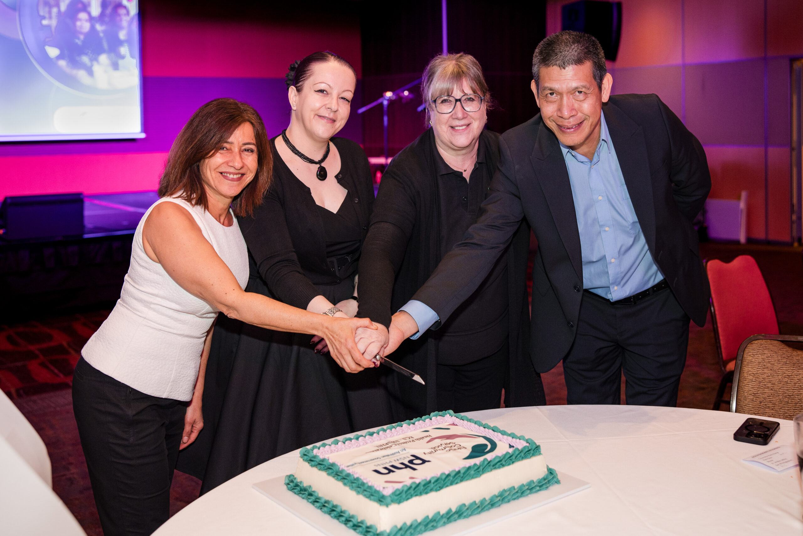 Celebrating the success of the Winter Readiness Education Program: SWSPHN's Bessie Berberovic (middle left) with Ethnic Community Services' Amal Madani (left), Ellen Gore (middle right) and Minh Le (right).